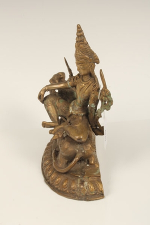 Eastern bronze figure group modelled as a stylised recumbent lion, a Goddess seated on its back, - Image 10 of 12
