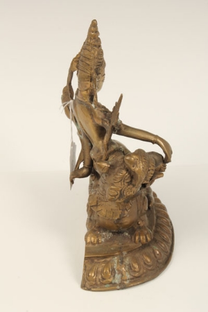 Eastern bronze figure group modelled as a stylised recumbent lion, a Goddess seated on its back, - Image 8 of 12