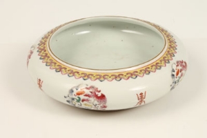 Chinese shallow bowl, painted in famille rose colours, mons with Dragon and Chinese characters - red