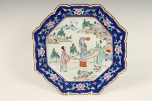 Chinese octagonal plate, painted in colours with a central panel of figures in landscape, 32cm