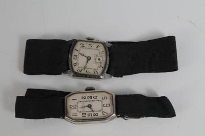 Two 1920s ladies' silver wristwatches on black silk straps