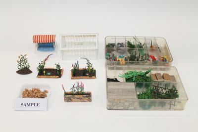Britains plaster floral miniature garden collection including greenhouses, garden furniture, roller,