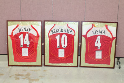 Three framed Arsenal Home Team shirts - signed Dennis Bergkamp, Thierry Henry and Patrick Vieira,