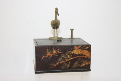 1950s Japanese lacquered cigarette dispenser with press-button mechanism and cigarette holder in the