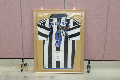 Framed Newcastle United shirt - signed Alan Shearer, with 'Shearer' and no. '9' printed on the back