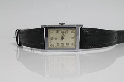 Art Deco gentlemen's Sigma wristwatch with rectangular dial, luminous numerals and hands in chromium