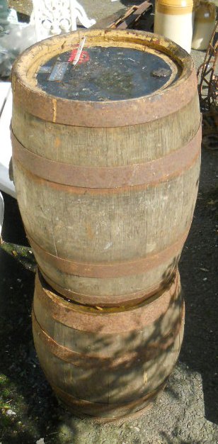 Two coopered wooden barrels