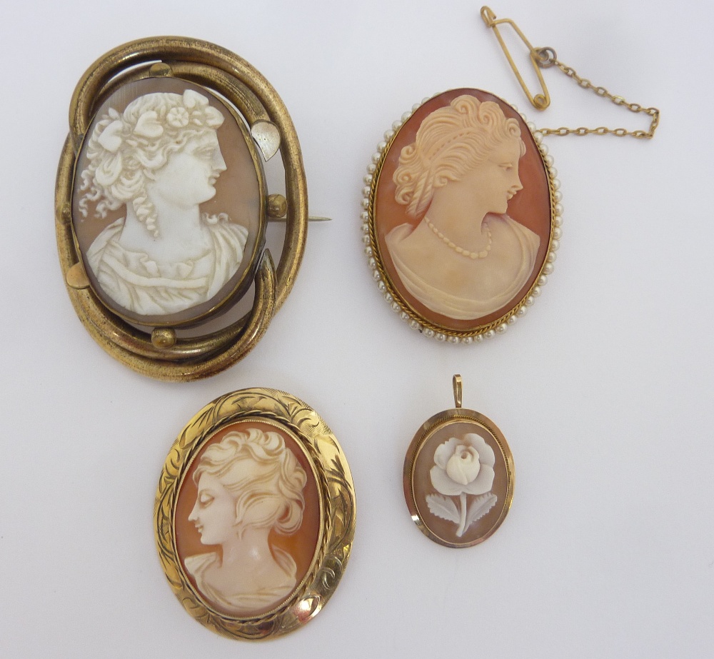 FOUR CAMEO BROOCHES, two brooches depicting women in profile, the third a Greek godess in profile