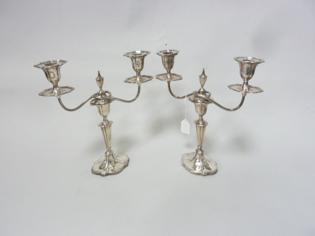 A PAIR OF SILVER WEIGHTED TWIN BRANCH CANDLESTICKS, (mark rubbed) (2)