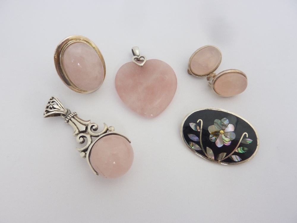 A COLLECTION OF ROSE QUARTZ JEWELLERY, to include two pendants, a ring, a pair of ear clips and a