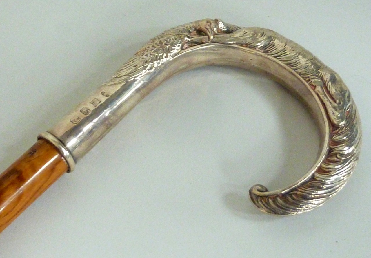 A BROADWAY & CO SILVER CROOK HANDLE WALKING CANE, of hunting interest, modelled as a hunting dog