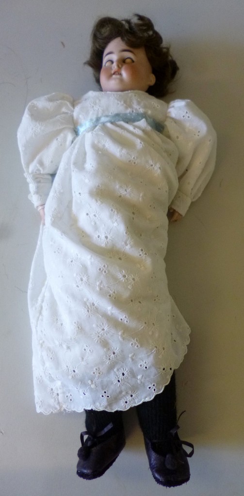 AN ARMAND MARSEILLE BISQUE HEAD DOLL, nape of neck marked ‘3200 A.M. 0 1/2 DET, made in Germany’,
