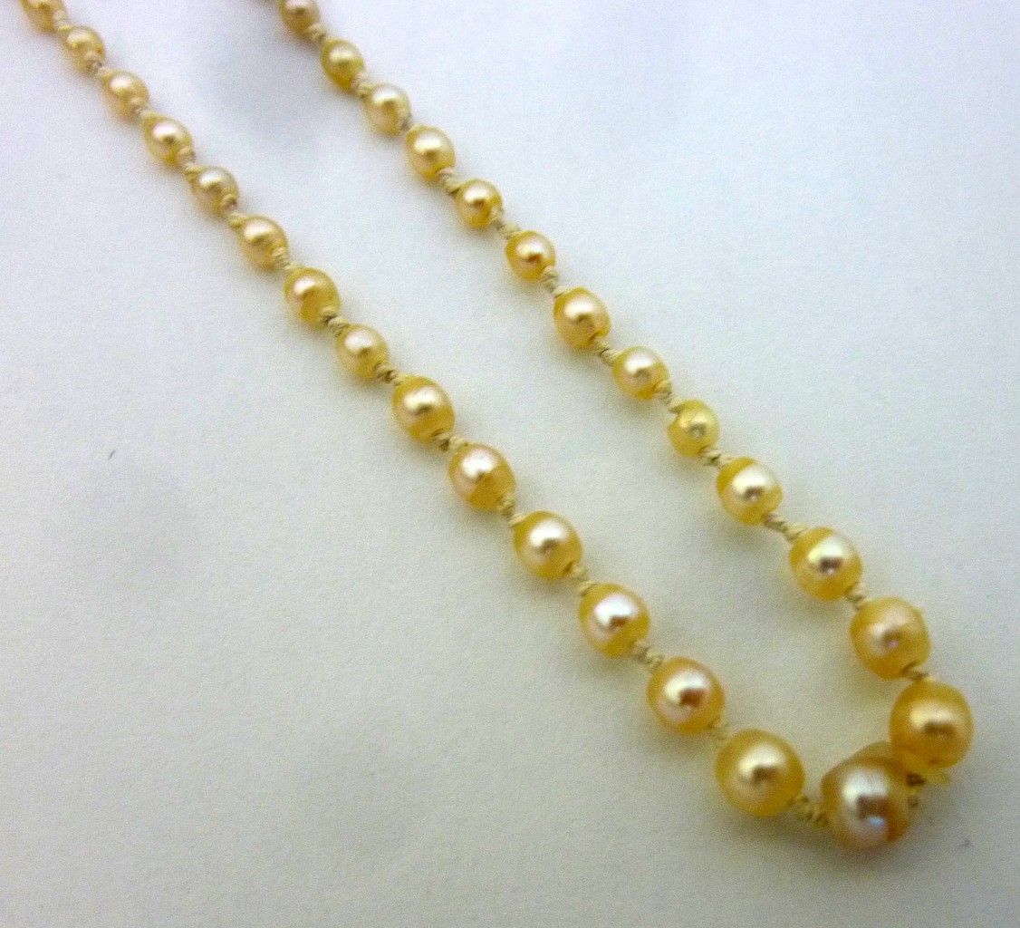 A NATURAL PEARL NECKLACE, designed as a single-strand of graduated pearls, double knotted, with