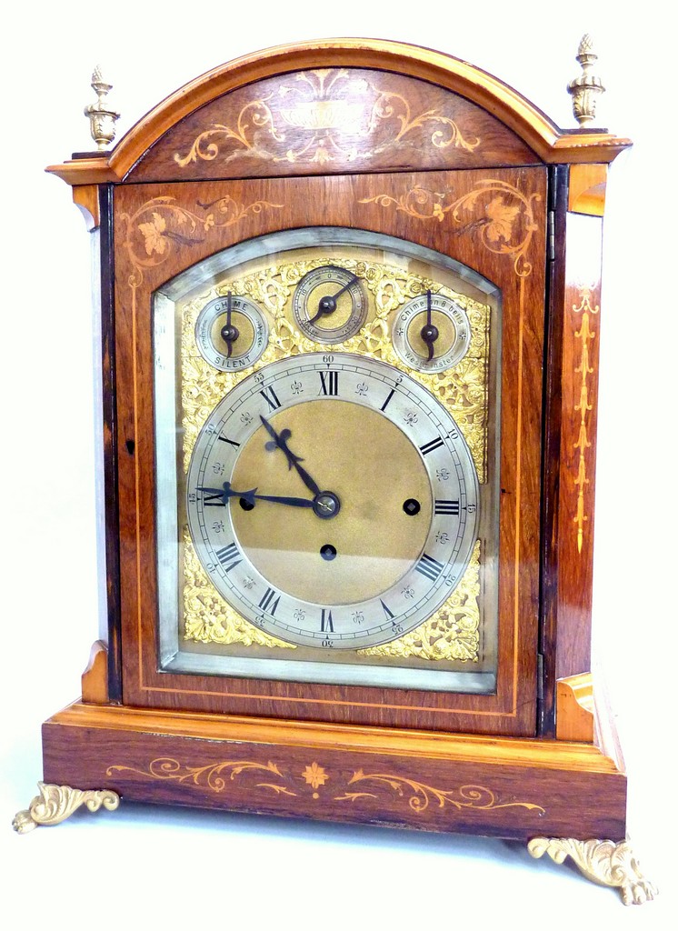 A ROSEWOOD BRACKET CLOCK, late 19th Century, arched and marquetry inlaid chamfered case with brass
