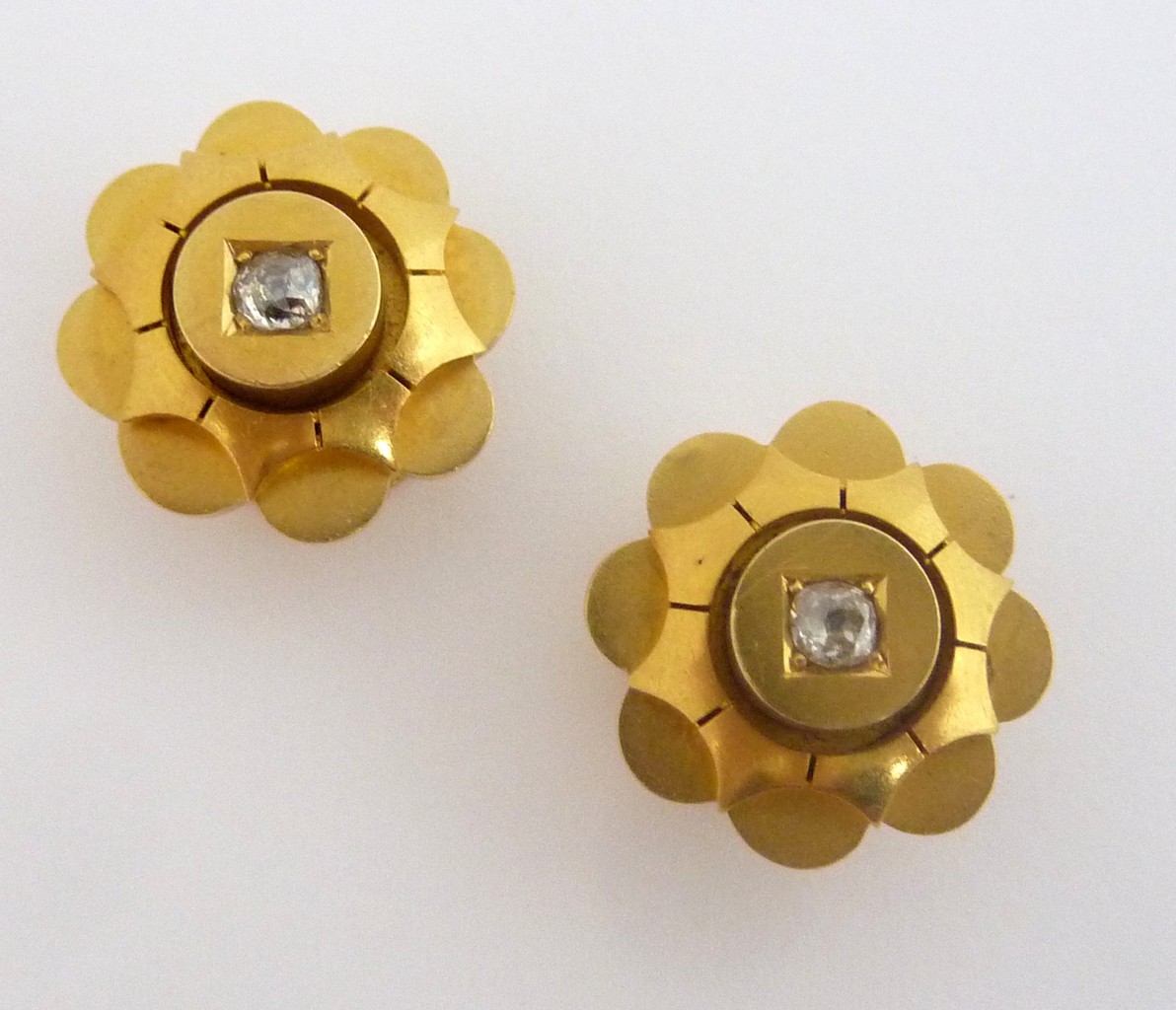 A LATE 19TH CENTURY DIAMOND PAIR OF DRESS STUDS, the old-cut diamonds on raised circular panel to