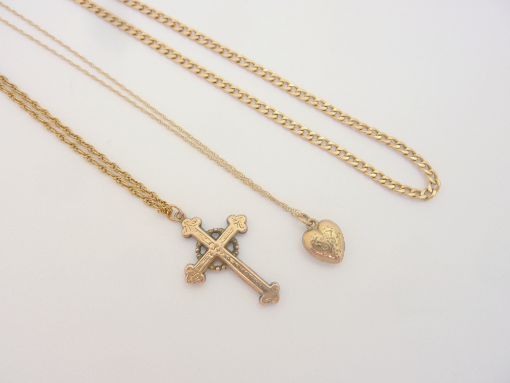 A COLLECTION OF 9CT GOLD, to include three chains, a decorative crucifix pendant and a small heart