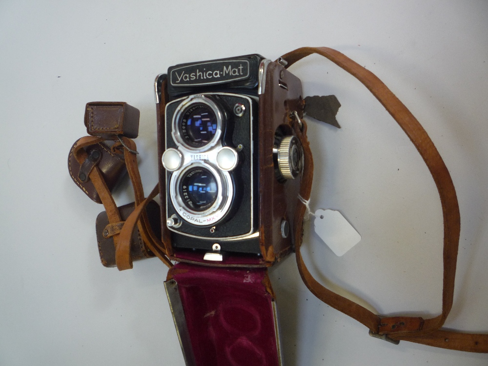A YASHICA-MAT TLR CAMERA, in leather case with 80mm 1:3.2 and 3.5 lenses