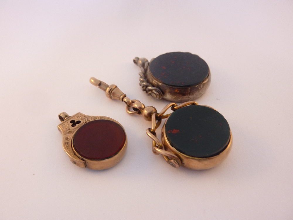 THREE WATCH FOBS, all inlaid bloodstone and cornelian, two fobs stamped 9ct, the other