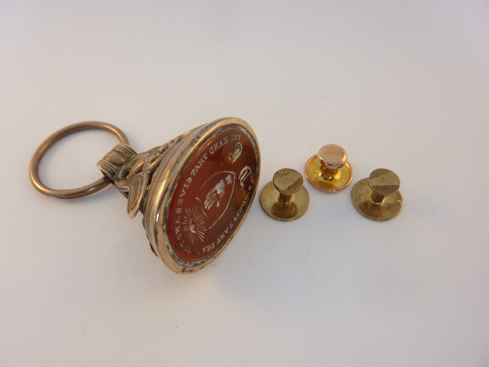 A LARGE CORNELIAN FOB AND GOLD BUTTONS, the three buttons stamped 9ct (4)