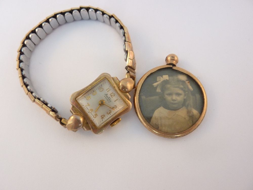 AN EXPANDABLE 9CT GOLD WATCH, and a picture locket (2)