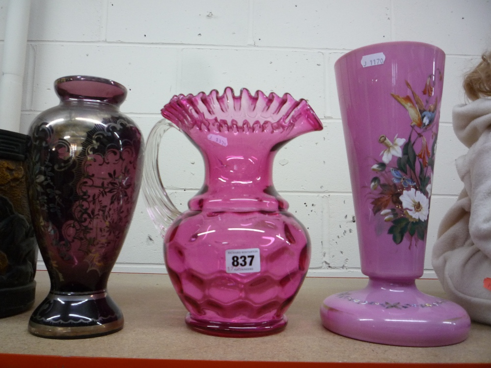 A RUBY GLASS JUG, and two glass vases (3)