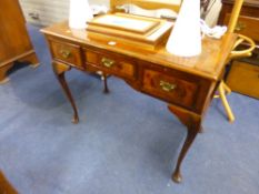 A 19TH CENTURY WALNUT SIDE TABLE, with quarter veneered and crossbanded top, three drawers on