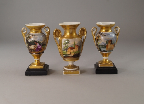 A pair of Paris porcelain twin handled vases, late 19th/ early 20th century, of urn from,