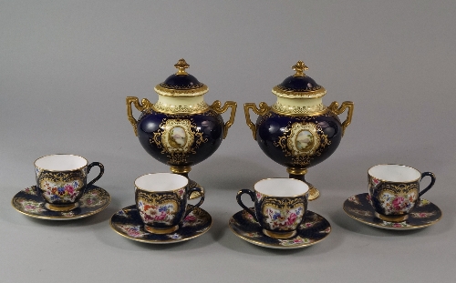 A pair of Coalport porcelain twin-handled urns with covers, late 19th/ early 20th century, the cover