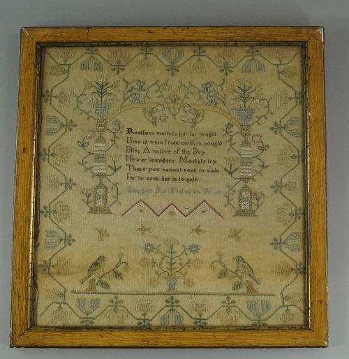 An early 19th century embroidered sampler by Elizabeth Farr, featuring an elaborate floral