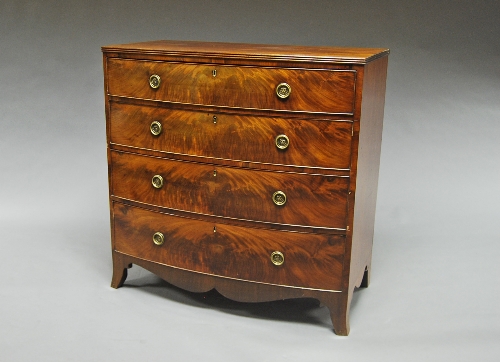 A late 19th century flame mahogany bow front chest, the top with reeded edge over four long