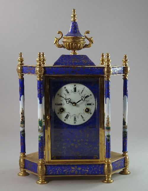 A large brass and enamel mantel clock, 20th century, decorated in the Arabic taste, the body of