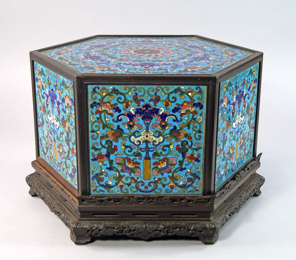A large and Impressive Chinese octagonal cloisonné hat box, hardwood cover and stand, Possibly