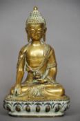 A large Oriental gilt bronze model of Buddha
Typically modelled seated in the lotus position,