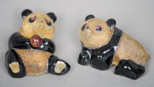 Two Chinese silver gilt and black enamelled brooches
Modelled as pandas with ruby set eyes, both