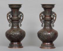 A pair of late 19th/early 20th century Japanese bronze vases
Each decorated with birds amongst