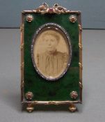 A Russian gold mounted, jade, diamond and ruby set photograph frame, bears hallmarks for Dmitrii