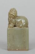 A Chinese carved jade seal
The top carved with a dog-of-fo, above script.  7.75 cms high.