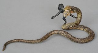 A late 19th century Austrian cold painted bronze model of a snake
The snake  holding a Negro child