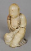 A small Chinese carved soapstone figure of Buddha
Modelled seated wearing engraved robes.  7 cms