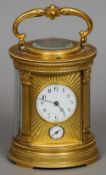 A 19th century French ormolu cased four glass carriage alarm clockThe white enamelled dial with
