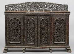 A 19th century Anglo-Indian carved rosewood side cabinet
The pierced florally carved back above