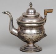 An early 19th century American silver teapot, maker's mark possibly for John McMullin
The hinged