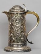 A massive Victorian silver lidded tankard converted to a jug, hallmarked London 1859, maker's mark