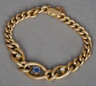 A Victorian/Edwardian unmarked gold, diamond and sapphire set bracelet
Of oval and curb link