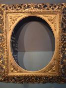 A 19th century Florentine giltwood and gesso frame
With oval aperture.  65 x 74 cms overall.