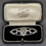 An Art Deco 14 ct white gold diamond set brooch 
Of pierced lozenge form.  5 cms wide.   CONDITION