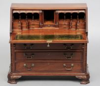 An 18th century style mahogany miniature bureau by Brights of Nettlebed
The fall enclosing a