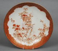 A late 19th century Japanese kutani charger
Centred with birds amongst foliage inside a gilt