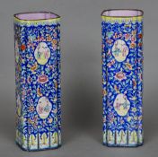 A pair of 19th century Canton enamel sleeve vases
Each of lobed square form, decorated with