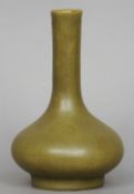 A Chinese tea dust glaze porcelain vase
The elongated neck above the squat bulbous body, the